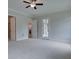 Main bedroom with ceiling fan and access to patio at 7375 Winderlea Ln, Cumming, GA 30040