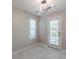 Bright dining area with tile floors, window and exterior access at 1983 Smithfield Ave, Ellenwood, GA 30294
