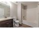 Clean bathroom with tub/shower combo and dark vanity at 1983 Smithfield Ave, Ellenwood, GA 30294