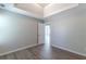 Well-lit bedroom with door to hallway and new flooring at 1983 Smithfield Ave, Ellenwood, GA 30294
