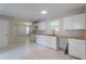 Newly renovated kitchen with white cabinets and wood countertops at 1983 Smithfield Ave, Ellenwood, GA 30294