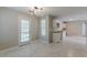 Modern dining area with tile floors and kitchen access at 1983 Smithfield Ave, Ellenwood, GA 30294