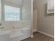 Updated bathroom with soaking tub, shower, and new flooring at 1983 Smithfield Ave, Ellenwood, GA 30294