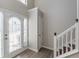 Bright entryway with stairs and closet at 1983 Smithfield Ave, Ellenwood, GA 30294
