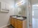 Double vanity bathroom with new flooring and updated fixtures at 1983 Smithfield Ave, Ellenwood, GA 30294