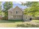 House with a large backyard and wooden fence at 1983 Smithfield Ave, Ellenwood, GA 30294