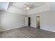 Main bedroom with tray ceiling, fan and hardwood floors at 1983 Smithfield Ave, Ellenwood, GA 30294
