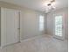 Dining area with tile floor, window, and door to exterior at 1983 Smithfield Ave, Ellenwood, GA 30294