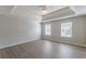 Large main bedroom with tray ceiling and ceiling fan at 1983 Smithfield Ave, Ellenwood, GA 30294