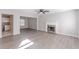 Spacious living room with fireplace and hardwood floors at 1983 Smithfield Ave, Ellenwood, GA 30294