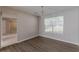 Bright dining room with hardwood floors and chandelier at 1983 Smithfield Ave, Ellenwood, GA 30294