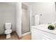 Small bathroom with shower and white vanity at 1880 Vesta Ave, Atlanta, GA 30337
