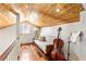 Cozy loft area with hardwood floors and wood ceiling at 1880 Vesta Ave, Atlanta, GA 30337