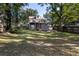 Spacious backyard with a large lawn and wooden fence at 1880 Vesta Ave, Atlanta, GA 30337