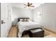 Simple bedroom with ceiling fan and tiled floors at 1880 Vesta Ave, Atlanta, GA 30337