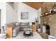 Spacious living room featuring a stone fireplace and comfortable seating at 1880 Vesta Ave, Atlanta, GA 30337