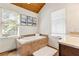 Relaxing bathroom with soaking tub and hardwood floors at 1880 Vesta Ave, Atlanta, GA 30337