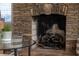 Stone fireplace with wood mantel and hearth at 1880 Vesta Ave, Atlanta, GA 30337
