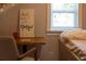 Cozy bedroom with built-in window seat and desk area at 1880 Vesta Ave, Atlanta, GA 30337