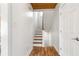 Bright stairwell with hardwood floors and wooden railing at 1880 Vesta Ave, Atlanta, GA 30337