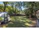Large backyard with lush lawn and greenhouse at 1880 Vesta Ave, Atlanta, GA 30337