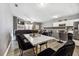 Open concept dining area with marble-top table and black velvet chairs at 2996 Jonesboro Se Rd # E, Atlanta, GA 30354