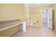 Laundry room with built-in counter and access to additional storage at 155 Skyview Dr, Social Circle, GA 30025