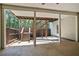 Covered patio with stairs leading to deck above at 155 Skyview Dr, Social Circle, GA 30025