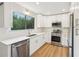 Modern kitchen featuring white cabinets and stainless steel appliances at 1478 Surf Ne Ct, Marietta, GA 30066