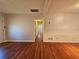 Long hallway with hardwood floors connecting rooms at 3801 Orchard Se Rd, Smyrna, GA 30080