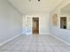 Spacious living room featuring tiled floors and French doors at 3801 Orchard Se Rd, Smyrna, GA 30080