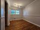 Charming bedroom with hardwood floors and two windows at 3801 Orchard Se Rd, Smyrna, GA 30080