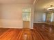 Spacious living room with hardwood floors and entry to hallway at 3801 Orchard Se Rd, Smyrna, GA 30080