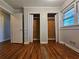 Bedroom with double closets and hardwood floors at 3801 Orchard Se Rd, Smyrna, GA 30080