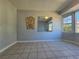 Sunlit living room with tiled floors and a wall mirror at 3801 Orchard Se Rd, Smyrna, GA 30080