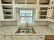 Double stainless steel sink with granite countertop at 3801 Orchard Se Rd, Smyrna, GA 30080