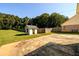 Spacious backyard with storage shed and grassy area at 2620 Old Covington Ne Rd, Conyers, GA 30013