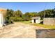 Large backyard with a storage shed and expansive green space at 2620 Old Covington Ne Rd, Conyers, GA 30013
