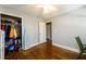 Well-lit bedroom with hardwood floors and large closet at 2620 Old Covington Ne Rd, Conyers, GA 30013