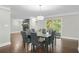 Dining area with glass table and chairs near fireplace and deck access at 2115 Tudor Castle Cir, Decatur, GA 30035