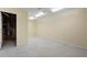 Unfinished basement with concrete flooring and overhead lighting at 3869 Merryweather Trl, Austell, GA 30106