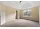 Bright bedroom featuring a large window and ceiling fan at 3869 Merryweather Trl, Austell, GA 30106