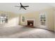 Spacious living room with a brick fireplace and access to a deck at 3869 Merryweather Trl, Austell, GA 30106