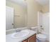 Clean bathroom with a single sink vanity, toilet and tub shower combo at 3869 Merryweather Trl, Austell, GA 30106