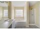Bathroom boasting a garden tub, shower, and updated vanity at 3869 Merryweather Trl, Austell, GA 30106