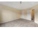 Bedroom with neutral walls, carpet flooring, and ample closet space at 3869 Merryweather Trl, Austell, GA 30106