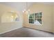 Bright dining room with chandelier and view to entryway at 3869 Merryweather Trl, Austell, GA 30106