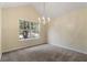 Dining room with chandelier and view to kitchen and entry at 3869 Merryweather Trl, Austell, GA 30106