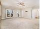 Spacious main bedroom with balcony access and carpeted floors at 1396 Sugarmill Oaks Ave, Atlanta, GA 30316