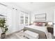 Spacious bedroom with a king-size bed and large windows at 373 Skylar Se Way, Atlanta, GA 30315